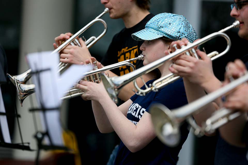Student musicians playing the trumpet