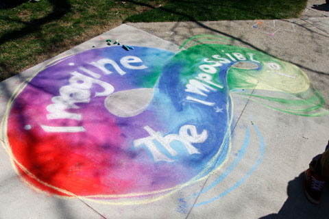 Colorful chalk decoration showing "Imagine the Impossible." 