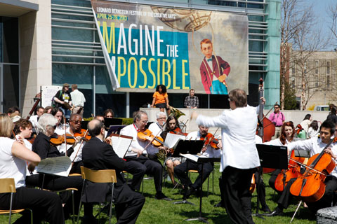 The Waltham Philharmonic Orchestra performing in front of the Shapiro Campus Center.