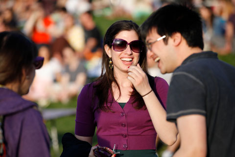 Attendees at the festival laughing together.