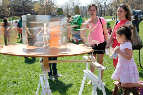 Attendees admiring an art installation on the Great Lawn