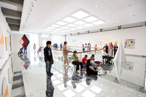 Visitors enjoy a tour of the Rose Art Museum.