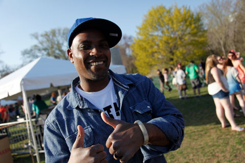 Jamele Adams, associate dean of student life giving double thumbs up.