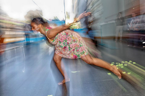 Bronte Velez ’16 dances in the Shapiro Campus Center Atrium.