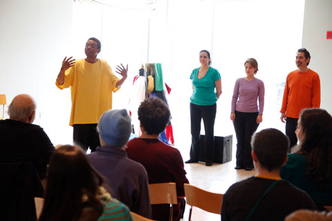 Performers with colorful shirts engaging their audience.