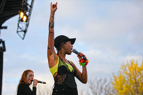 Two female performers on stage at Chapels Field.