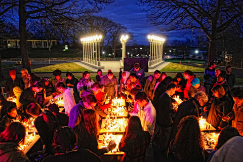 Glenn Kaino’s “The Burning Boards,” a collaborative chess tournament that uses burning candles for pieces, outside of the Rose Art Museum.