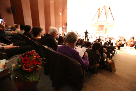 Patrons sitting for a Brandeis-Wellesley Orchestra performance.