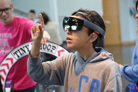 A child wears virtual reality glasses
