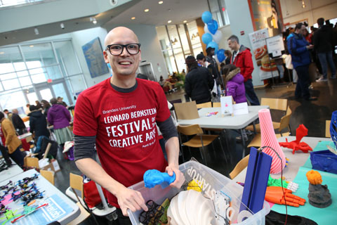 Ian Roy with colorful items printed on the MakerLab 3D printers.