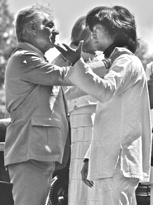 Leonard Bernstein holding the shoulders of Seiji Ozawa