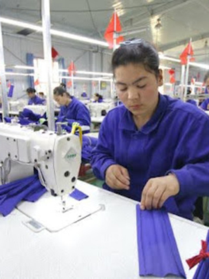 Photo of Uyghur Women sewing 