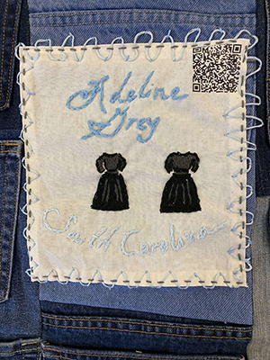 Sewn patch with the name Adeline Grey