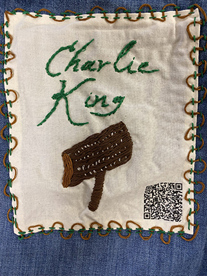 Sewn patch with the name Charlie King