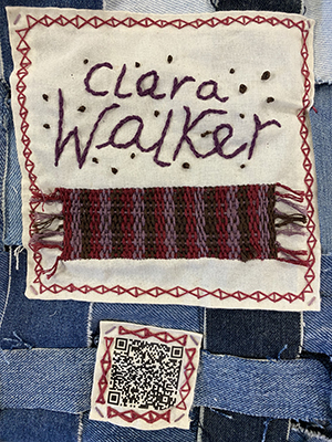 Sewn patch with the name Clara Walker