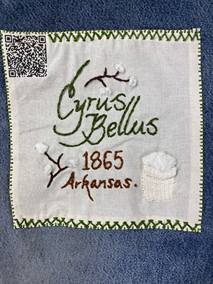 Sewn patch with the name Cyrus Bellus