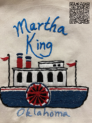 Sewn patch with the name Martha King