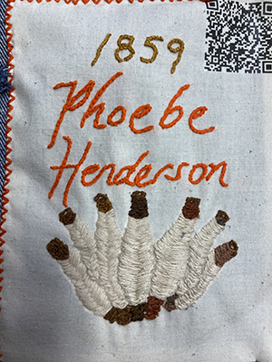 Sewn patch with the name Phoebe Henderson