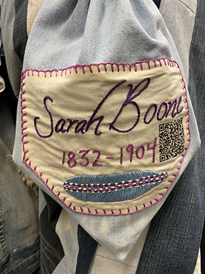 Sewn patch with the name Sarah Boone