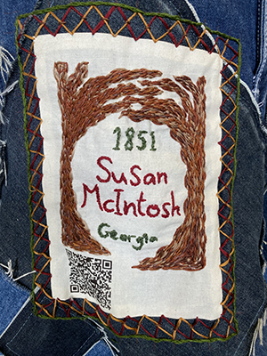 Sewn patch with the name Susan Mcintosh