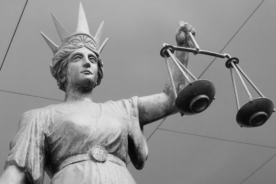 Statue of the Lady of Justice holding scales.