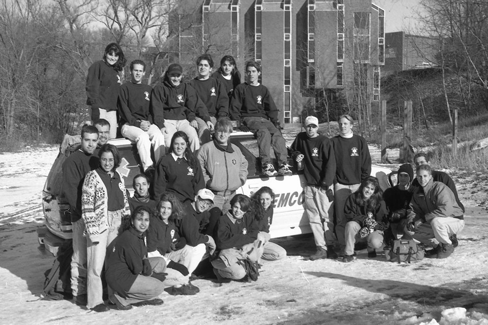 BEMCo members pose with a BEMCo truck in the snow