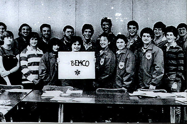 A group of BEMCo members stand in two rows in this black and white photo