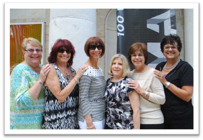 group of women pose for a photo