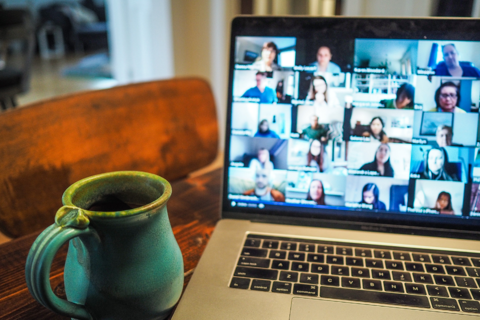 Picture of coffee mug next to zoom screen