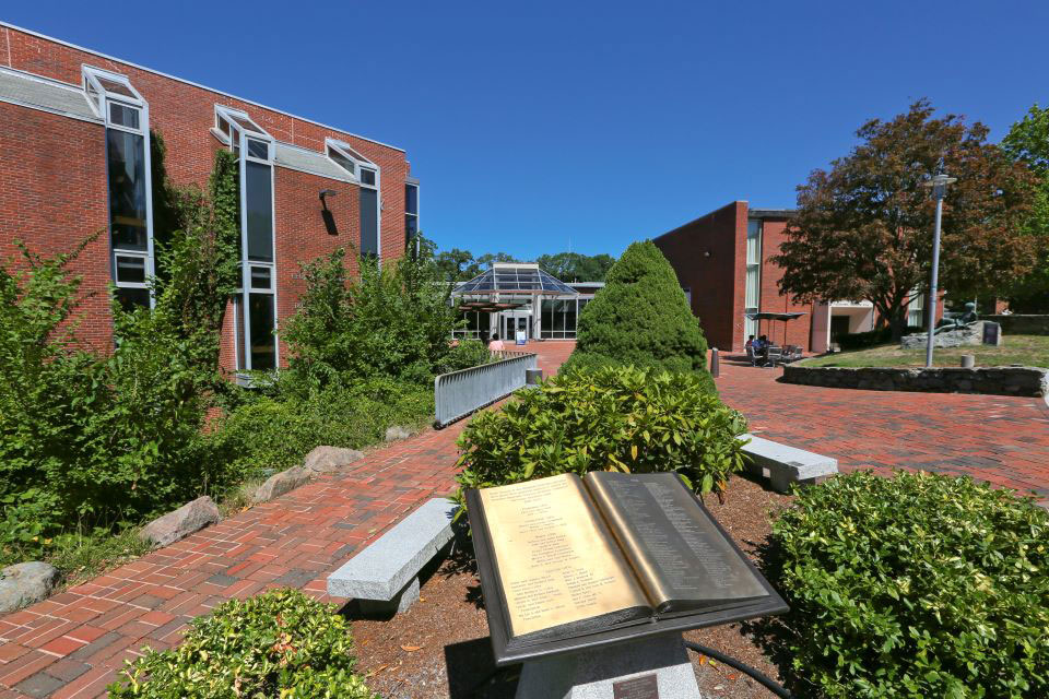 The front of the Goldfarb Library with the BNC book sculpture in the foreground