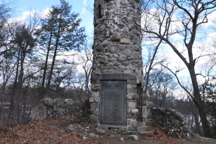 Norumbega Tower, constructed of grey stones of different sizes.