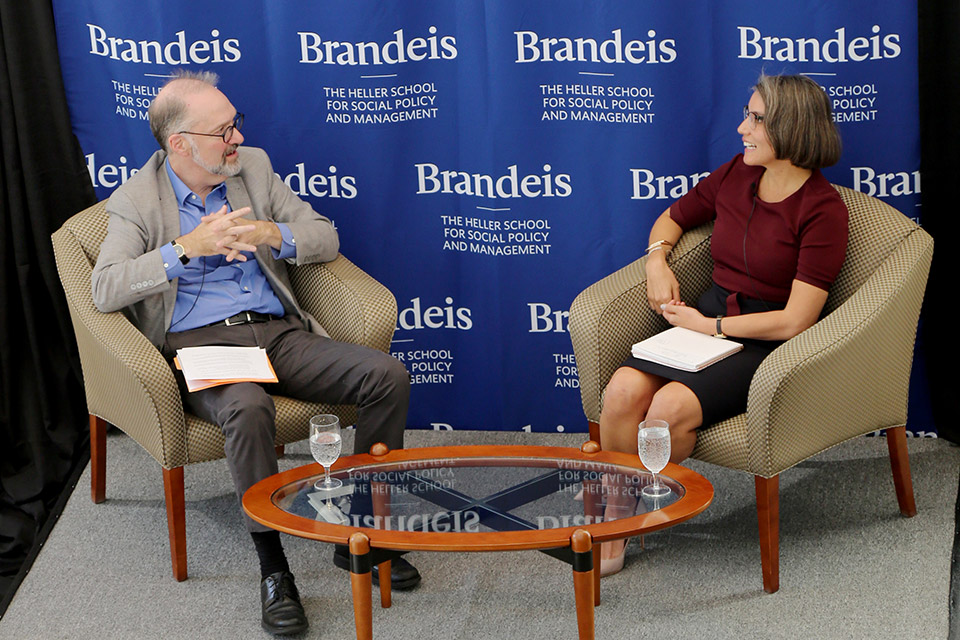 Conversation in front of Heller sub-brand logo