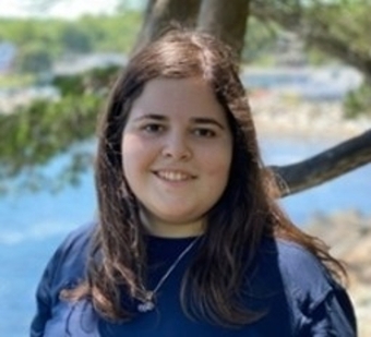 Emily Adelson in front of a body of water