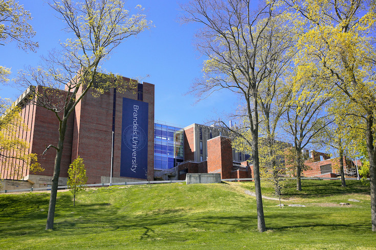 brick academic building on a hill