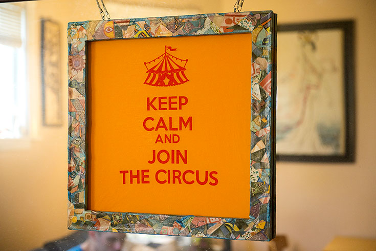 A colorful sign says "Keep Calm and Join the Circus"
