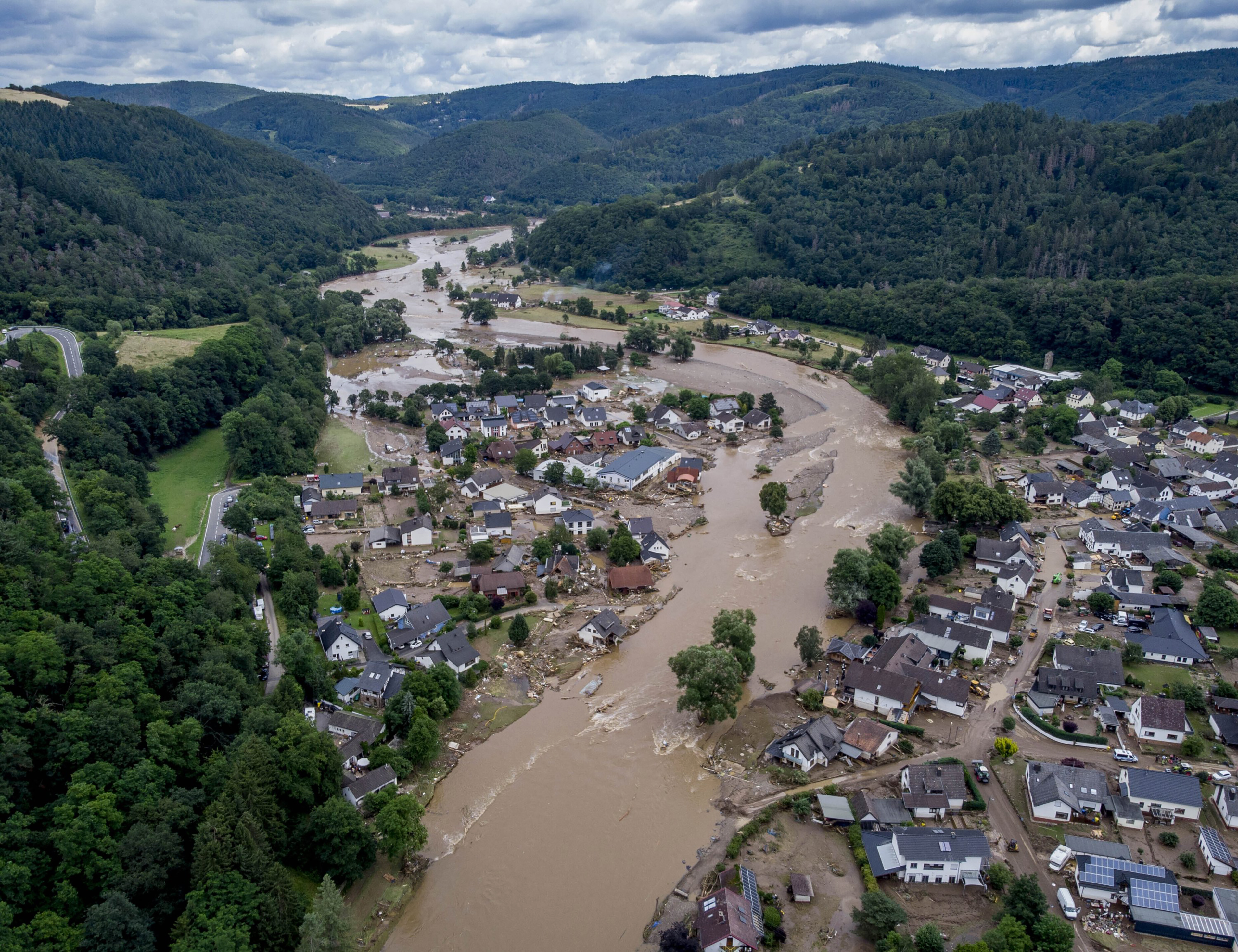 The Ahr river flowing past houses destroyed by floods in Insul, Germany, July 15, 2021.