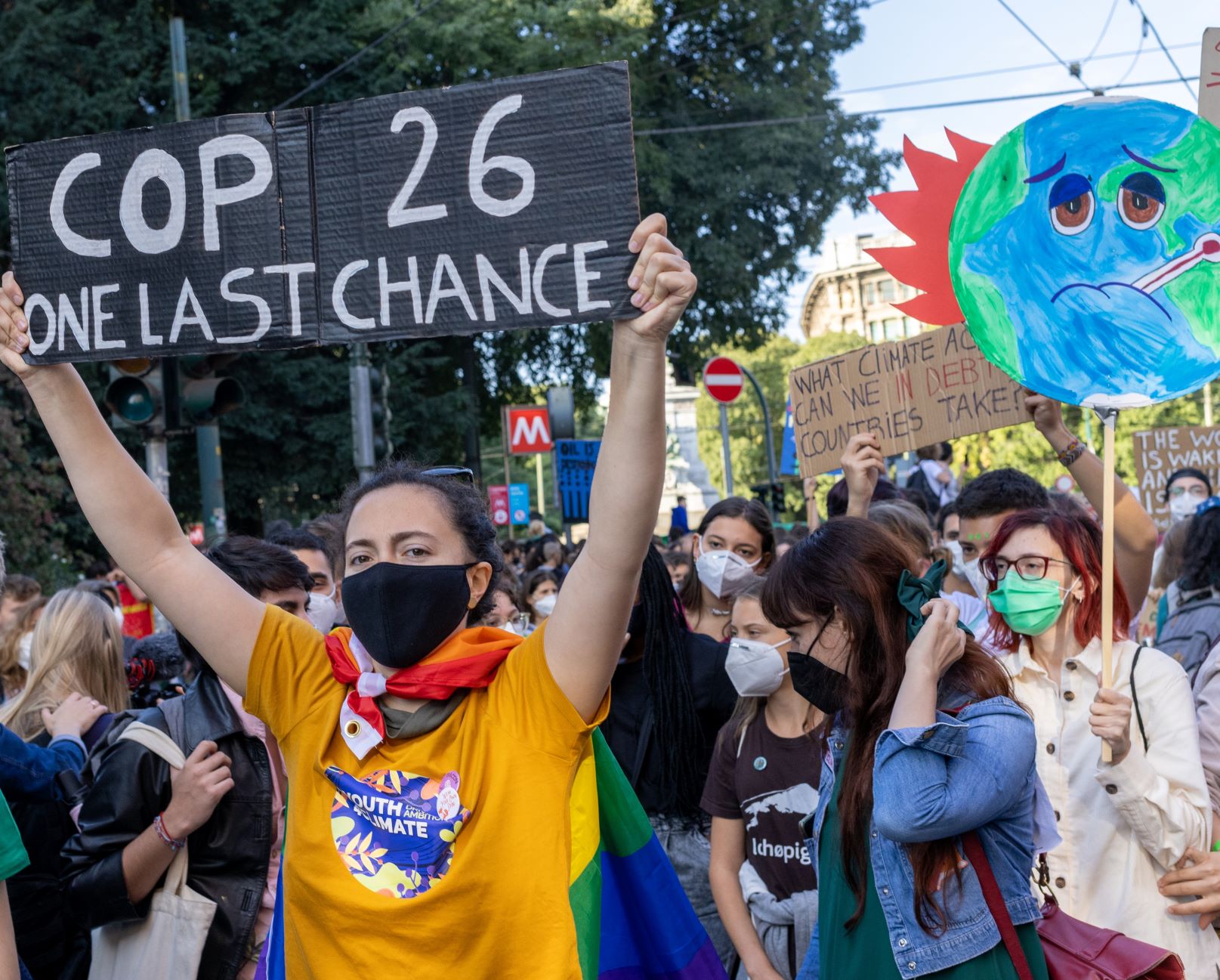 Young people display placards during the march that took place during the Pre-COP Event where the ministers prepare UN COP26 climate change conference in Milano, Italy on October 1, 2021