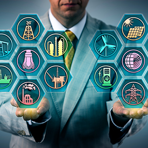 Man in a business suit holding various icons for energy in his hands