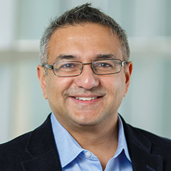 Headshot of Rajesh Sampath smiling