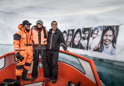 Picture of 3 people on a boat in the arctic
