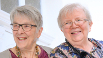 Image of Luise Pusch and her wife smiling