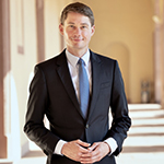 Head shot of Christoph Bode smiling in a suit