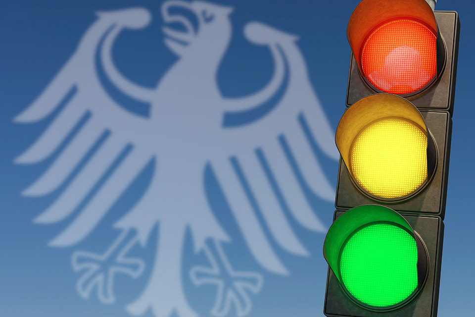 German eagle and a stop light on a blue background
