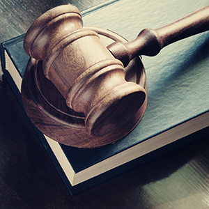 Gavel on brown and black background