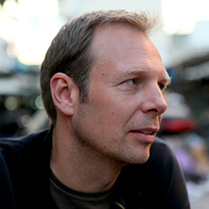 Headshot of Gerhard Schick looking into the distance