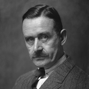 Black and white photo of Thomas Mann looking seriously at the camera