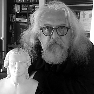 Head shot of Jaffrey with a sculpture