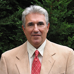 Head shot of Al Tapper smiling at camera