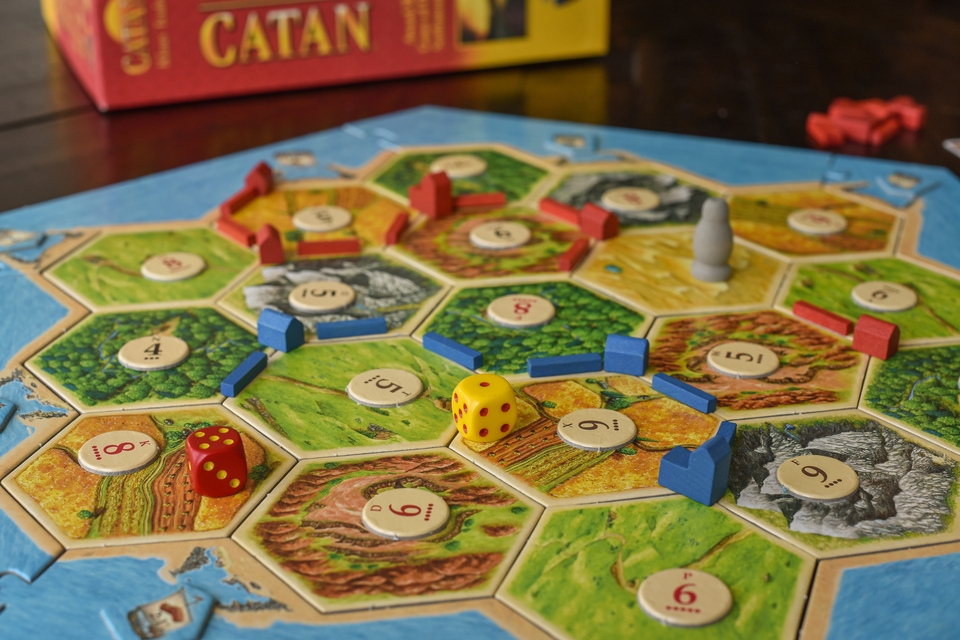 Dynamic image of Catan boardgame with the pieces on the board