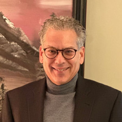 Headshot of Jack Weinstein smiling at camera